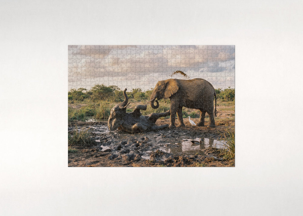 Elephant Calf Playing in the Mud jigsaw puzzle - flat puzzle