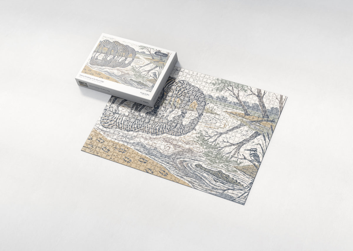 Zebras Drinking at the River Edge jigsaw puzzle - box and puzzle
